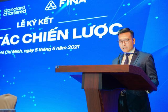FINA hợp tác chiến lược toàn diện cùng Standard Chartered Việt Nam - Ảnh 1. FINA hợp tác chiến lược toàn diện cùng Standard Chartered Việt Nam - Ảnh 1.
